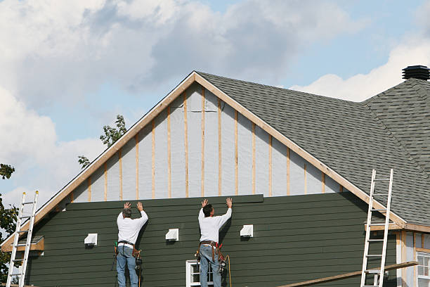 Professional Siding technician working in Holliston, MA